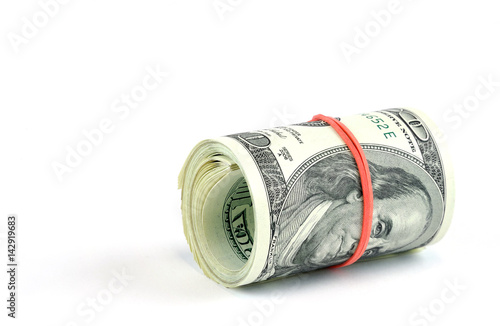 roll of hundred USA dollar bills with red rubber