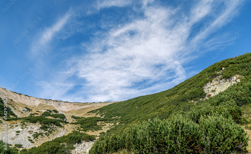 Fototapeta premium Beautiful cloudscape near Bezbog peak (2649 m) - Pirin National Park, Bulgaria
