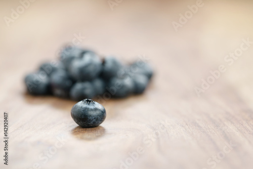 fresh garden blueberries on wood table, closeup photo