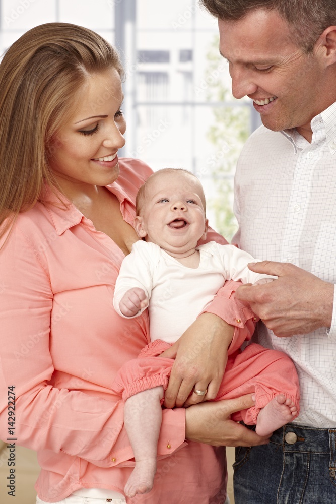 Happy family with smiling baby