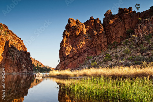 Reflections of rock formations at Glen Helen Gorge water hole photo