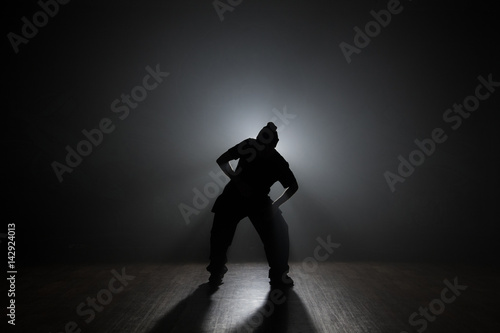 Hip-hop dancer backlit smoke