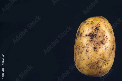 potatoes on a black