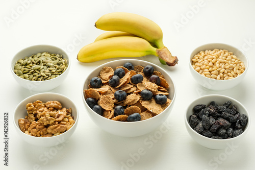 Healthy food. Multi grain flakes, nuts and bananas for breakfast.