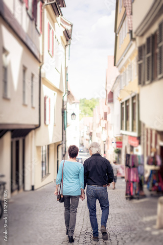 Senior Couple Walking Through The Streets Of T�bingen, Germany