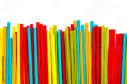 Pile of colorful straws isolated with white background.