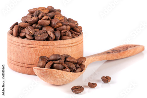 coffee beans in a wooden bowl with scoop isolated on white background