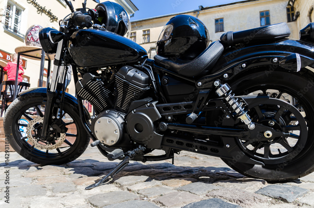 Classic black motorcycle on the street Classic black motorcycle on the street