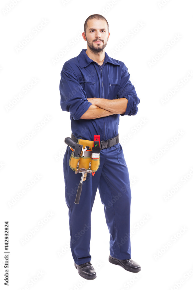 Portrait of a young worker standing with arms crossed on white background Portrait of a young worker standing with arms crossed on white background