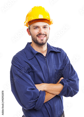 Young worker standing smiling on white background