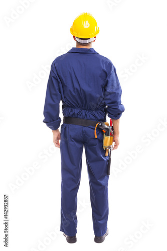 Young worker standing from back on white background