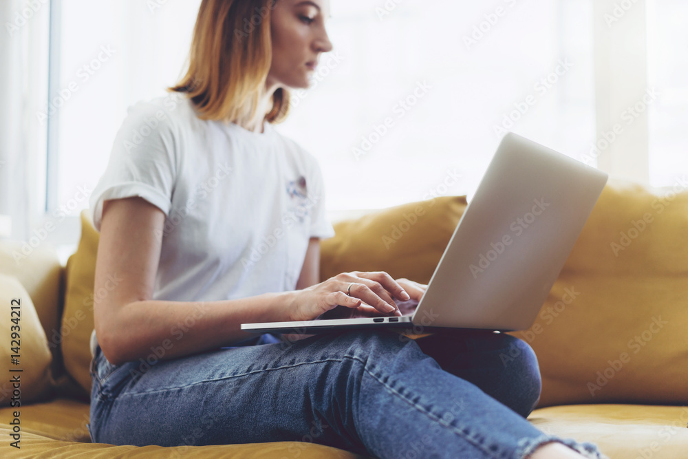 Hipster girl working on a portable computer from home, Blogger working place concept Hipster girl working on a portable computer from home, Blogger working place concept