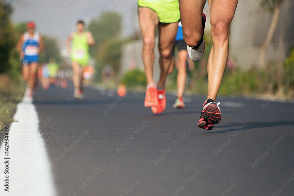 Marathon running race, runners feet on road Marathon running race, runners feet on road