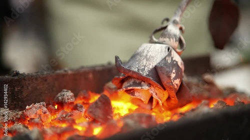 Wallpaper Mural Forging iron rose on the flames coals (side view close shot) Torontodigital.ca
