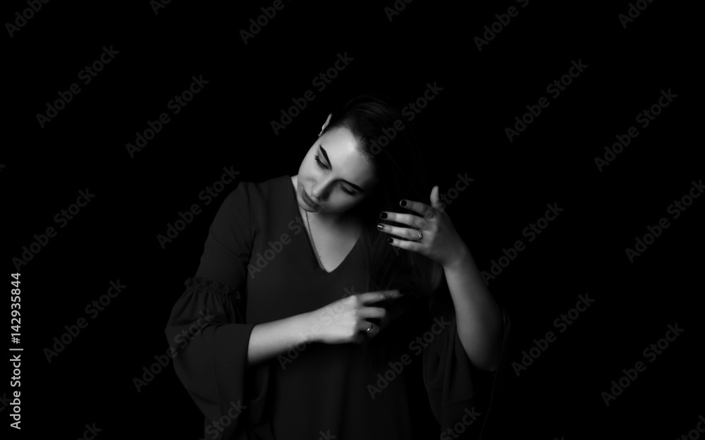 Young pretty woman uses hairbrush Grayscale Young pretty woman uses hairbrush Grayscale