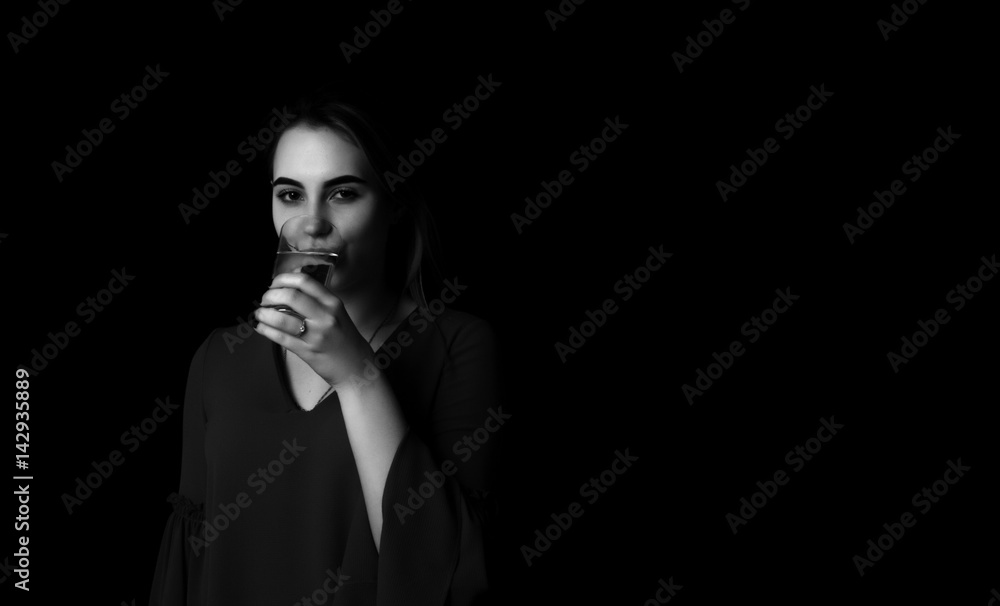 Young pretty girl drinks water Glass of mineral water Young pretty girl drinks water Glass of mineral water