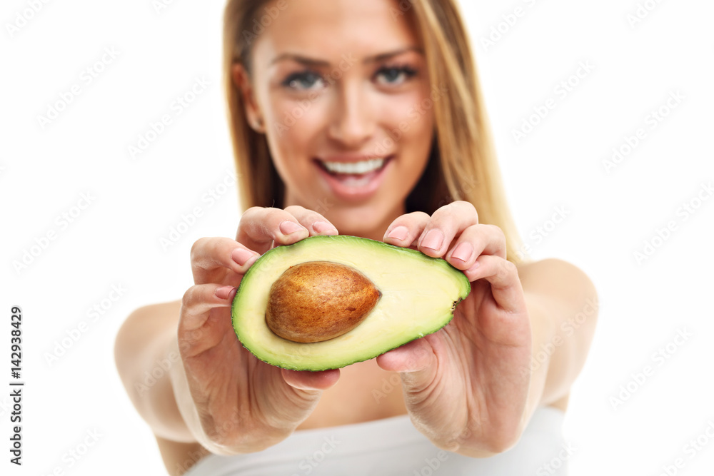 Portrait of attractive adult woman with avocado isolated over white background Portrait of attractive adult woman with avocado isolated over white background