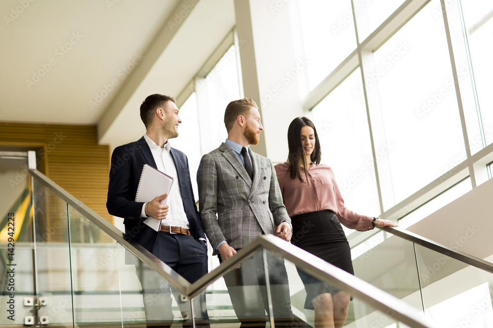 Business partners analyze the business results in modern office Business partners analyze the business results in modern office