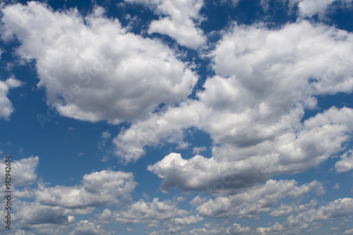 Heavy rain clouds in the blue sky