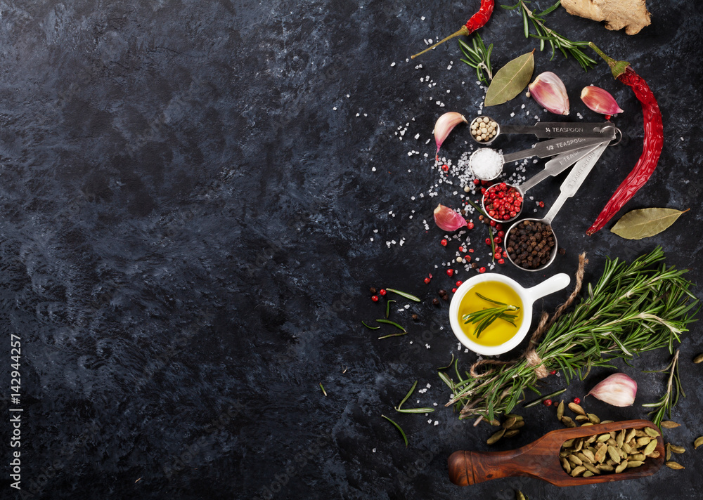 Herbs and spices over black stone Herbs and spices over black stone