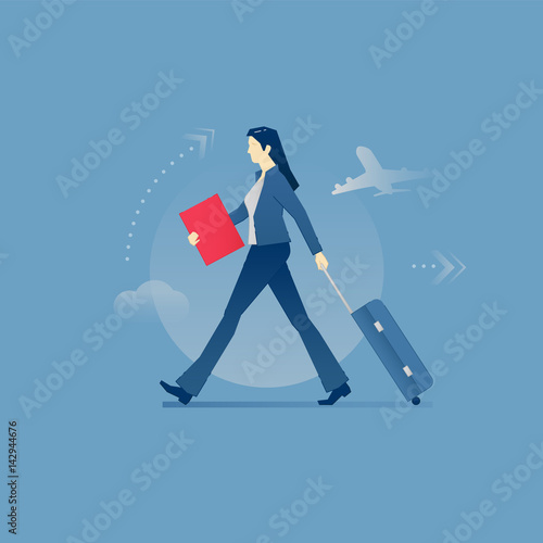 Young business woman carrying a luggage in business travel