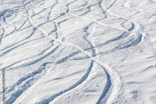 Ski and snowboard free ride tracks in powder snow
