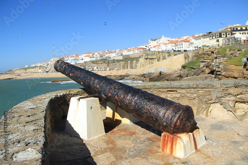 Old cannon next to a bay in ericeira Portugal