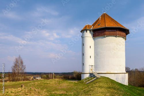 White tower of hydroelectric power plant in Bielkowo. Kashubia, Poland.