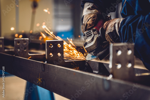 Worker Using Angle Grinder photo