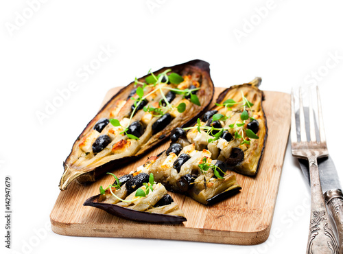 Eggplant  stuffed with black olives and feta isolated on white