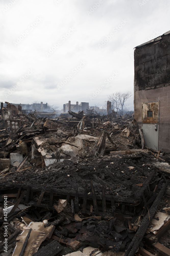 Homes sit smoldering after Hurricane Sandy on October 30; 2012 in the Far Rockaway area . Over 50 homes were reportedly destroyed in a fire during the storm on October 30; 2012 in New York City; NY Homes sit smoldering after Hurricane Sandy on October 30; 2012 in the Far Rockaway area . Over 50 homes were reportedly destroyed in a fire during the storm on October 30; 2012 in New York City; NY