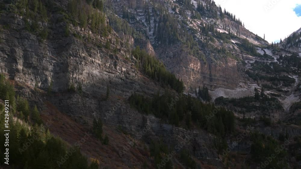 Aerial view of a beautiful mountainside and snowy cliffs in Utah. Aerial view of a beautiful mountainside and snowy cliffs in Utah.