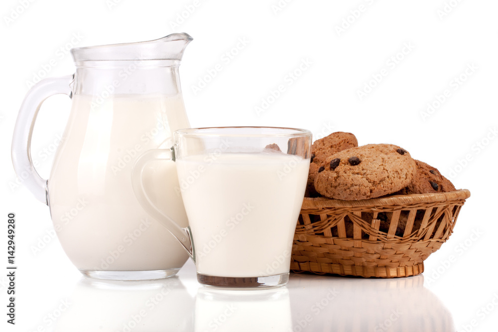 jug and glass of milk with oatmeal cookies in a wicker basket isolated on white background jug and glass of milk with oatmeal cookies in a wicker basket isolated on white background