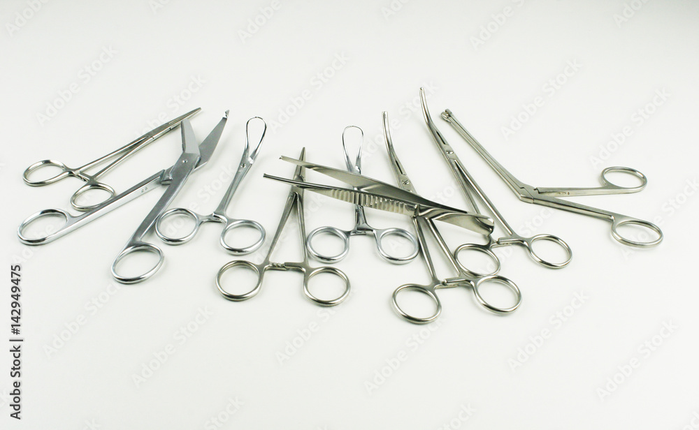 Surgical Instruments on grey background. Surgical Instruments on grey background.
