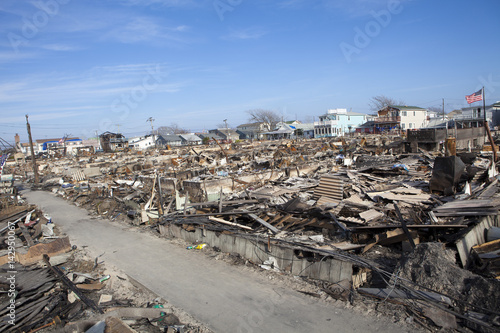 Obraz na płótnie NEW YORK -November12: Destroyed homes during Hurricane Sandy in the flooded neighborhood at Breezy Point in Far Rockaway area on November12, 2012 in New York City, NY w salonie