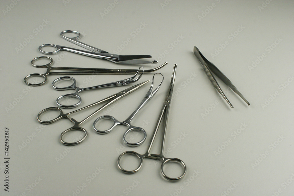 Surgical Instruments on grey background. Surgical Instruments on grey background.