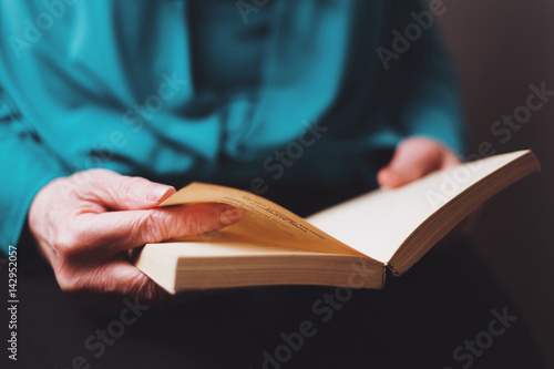 Old woman reading a book