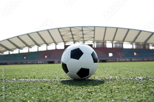 soccer ball on stadium grass line. © xy