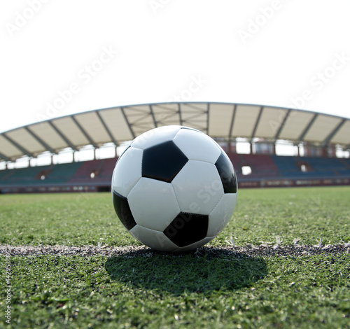 soccer ball on stadium grass line. © xy