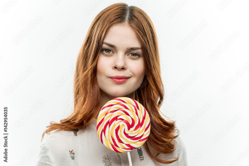 sweet candy, round lollipop in a woman's hand