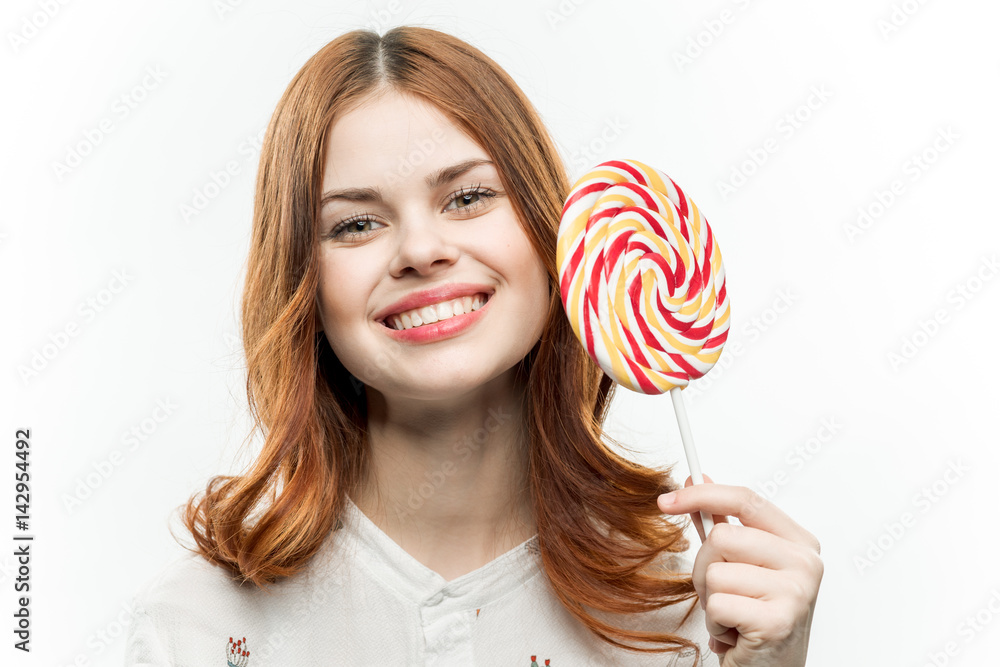 round lollipop near woman's face