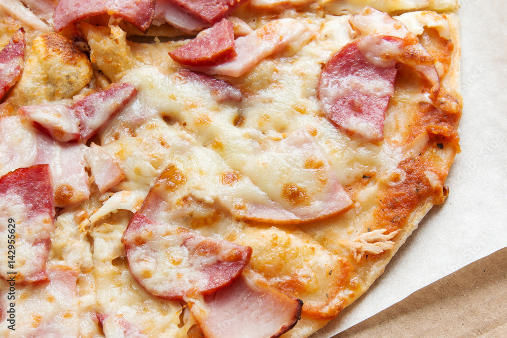 Baked Italian pizza with salami and cheese