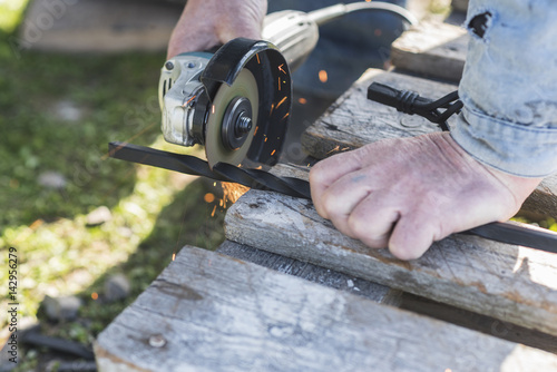 The process of cutting metal using the angle grinder