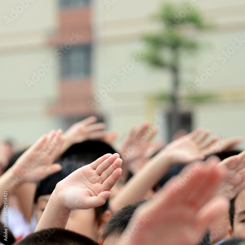 group of children with their hands up