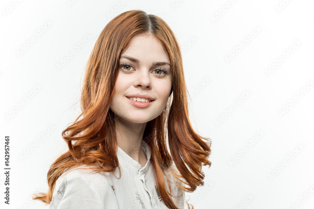 happy red-haired woman in a light shirt happy red-haired woman in a light shirt