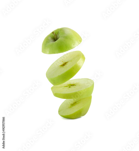 Apple slices flying in the air isolated on white background