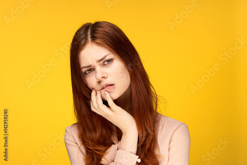 anxiety, woman on a yellow background