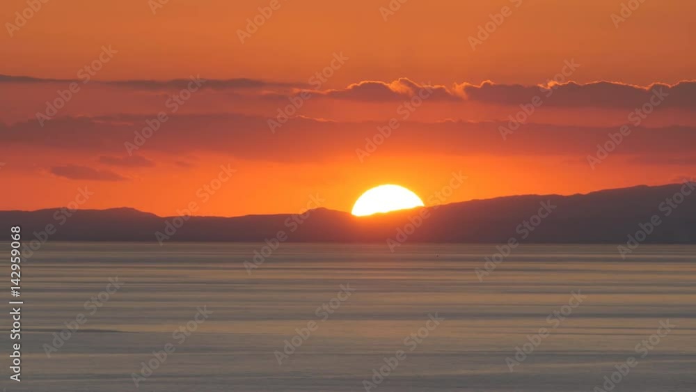 The sun sets in the sea. Timelapse The sun sets in the sea. Timelapse