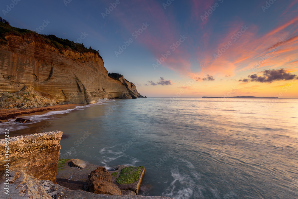 Logas the Sunset Beach and amazing rocky cliff in Peroulades. Corfu Island. Greece.
