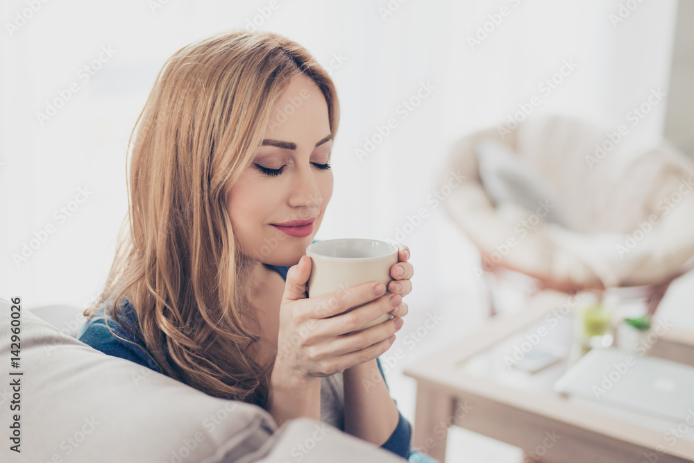 Young pretty cute woman enjoying coffee in the morning Young pretty cute woman enjoying coffee in the morning